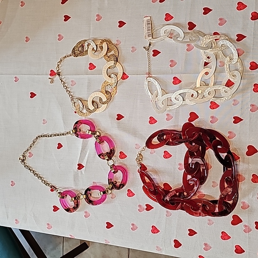 Four bundle chunky lucite necklaces